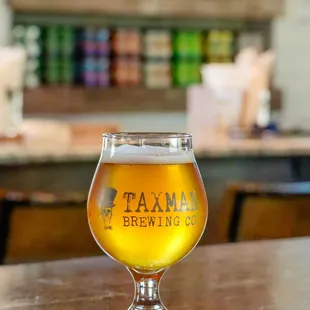 a glass of beer on a table