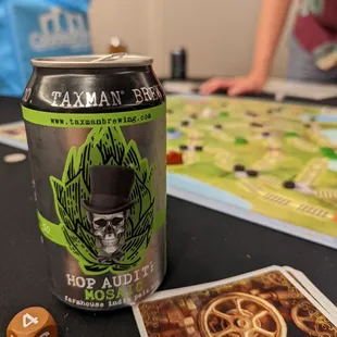 a can of beer and a dice