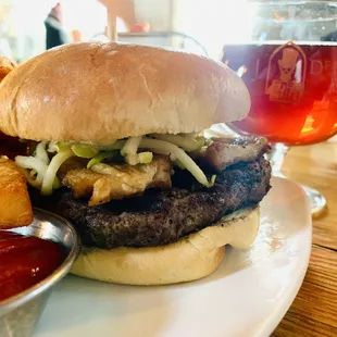 Tavern Burger with pork belly, apple fennel slaw, and a garlic aioli