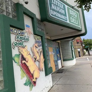 a sign for a restaurant on the side of a building