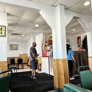 the interior of a restaurant with tables and chairs