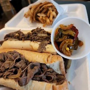 a plate of french fries and a roast beef sandwich