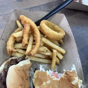1/2 grandson's burger, my 1/2 eaten burger, fries and onion rings