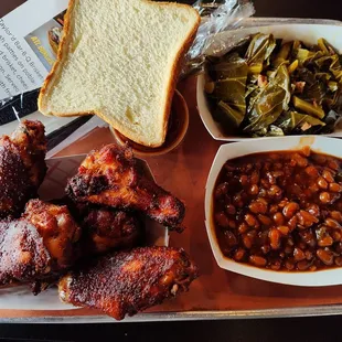 Chicken Wings, BBQ Baked Beans, Collard Greens, Bread and Habanero BBQ Sauce.