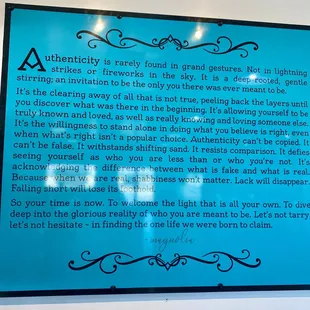 a blue sign with a poem on it