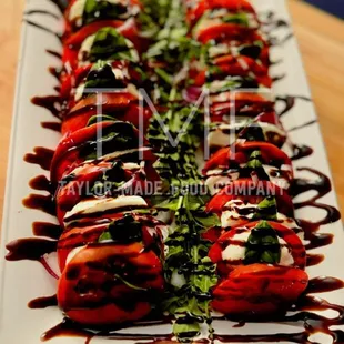 a plate of stuffed tomatoes