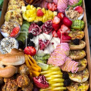 a box of fruit and donuts
