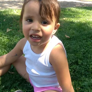 My granddaughter enjoying the shade.  Lots of big shady trees here.
