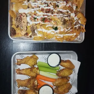 Appetizer nachos and lemon pepper wings