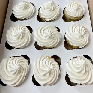a dozen cupcakes in a box