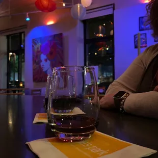 a woman sitting at a bar