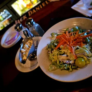 House salad with a side of blue cheese crumbles