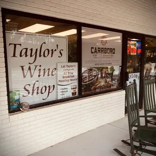 Storefront with rocking chairs. How cute is that?