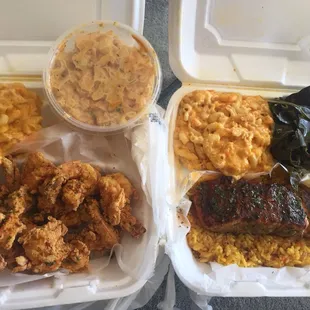 a variety of food items in a styrofoam container