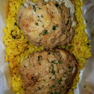 two crab cakes and rice