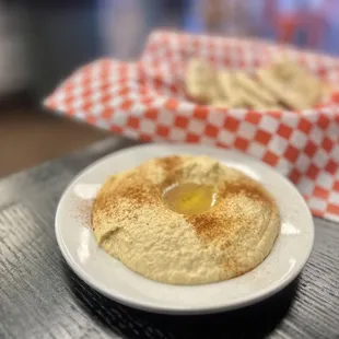 a hummusl on a plate