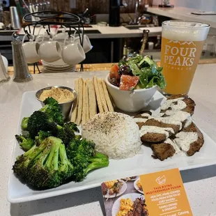 Cairo platter with lamb and beef, blackened broccoli, hummus and pita, Greek salad, and rice. Pairs well with a cold Kilt Lifter beer