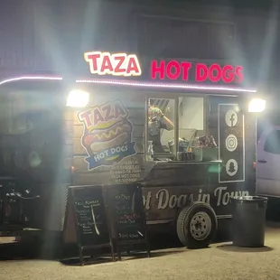 a taco truck parked in a parking lot