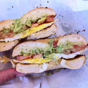 Plain bagel with egg, tomato, and avocado