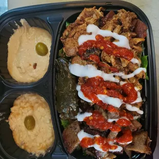 Chicken shawarma over rice and salad