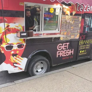 a taco truck parked on the side of the road