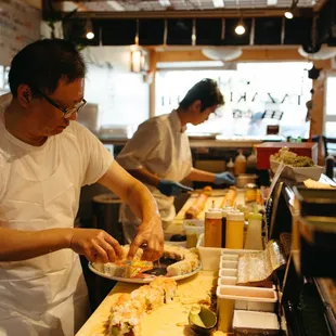 a man preparing food in a restaurant