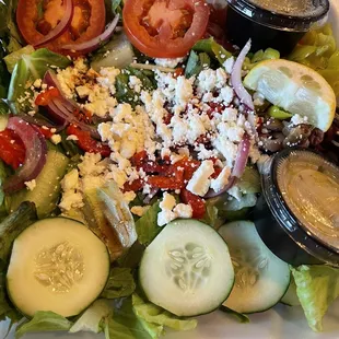 Greek salad prior to piling on the salmon add on.