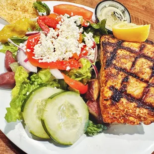 Grilled Salon with red potatoes and side salad with Greek dressing.