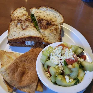 a grilled cheese sandwich and a salad