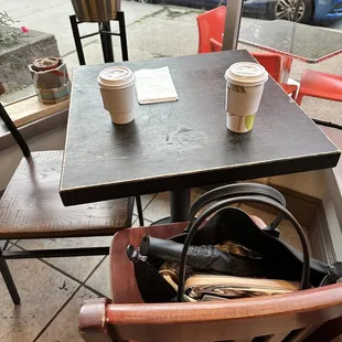 a table and chairs in a coffee shop