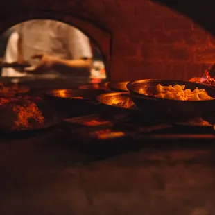 Wood-fired cooking with seasonal ingredients sourced closed to home