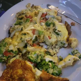 The big omelet with clearly raw onions