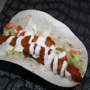 Can&apos;t go wrong with a delicious buffalo chicken taco with your choice of blue cheese or ranch dressing on top.
