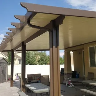 a patio with a pergol roof