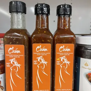 three bottles of hot sauce