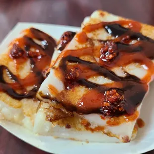 Turnip Cakes! Hoisin Sauce, Sriracha, and cilli oil not included. Haha