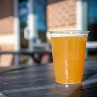 a glass of beer on a table