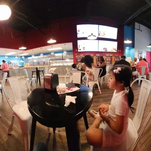 a woman eating a slice of pizza
