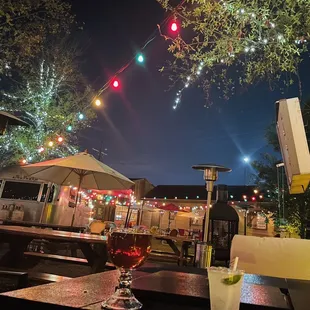 a table with a drink and umbrellas