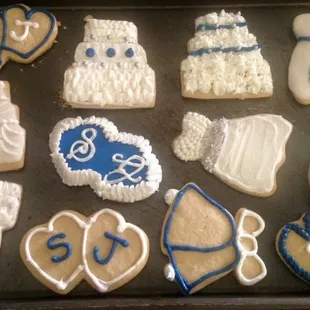 Custom navy blue and silver wedding cookies.