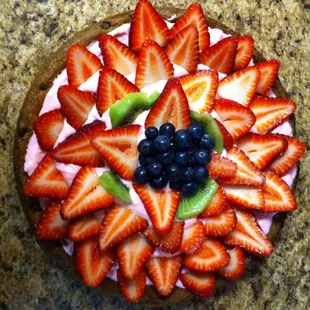 A custom small fruit cookie pizza.