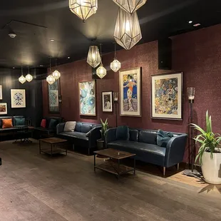 a living room with couches and tables