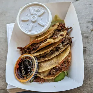 Birria tacos with salsa matcha