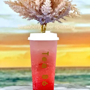 a cup with a plant in it