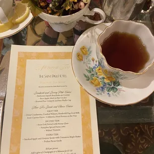 a menu and a cup of tea