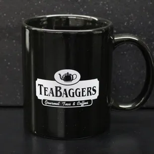 a black coffee mug with teabaggers logo