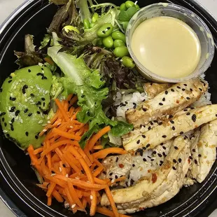 Fusion Bowl: Ginger tofu, edamame, greens, carrot, seasoned white rice, and wasabi dressing (vegan)
