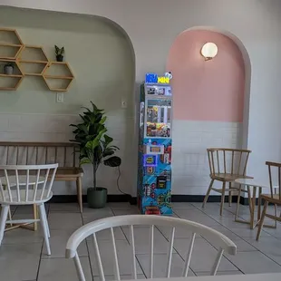 the inside of a restaurant with tables and chairs