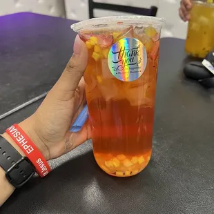 B5. Strawberry Mango Green Tea with passion fruit bursting boba, mango and strawberry fruit pieces.