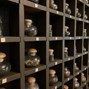 a wall of glass jars